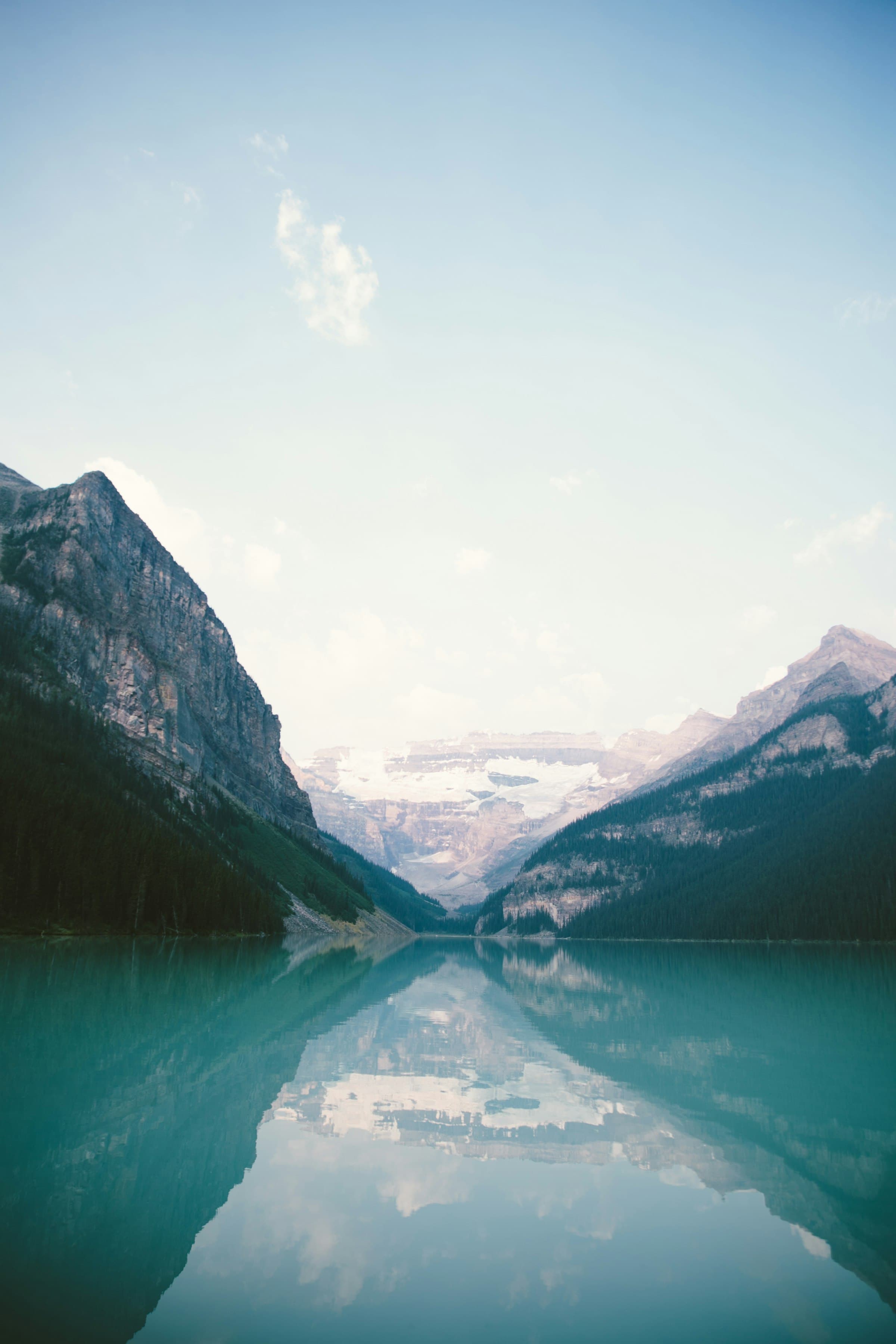Still turquoise mountain lake at soft light